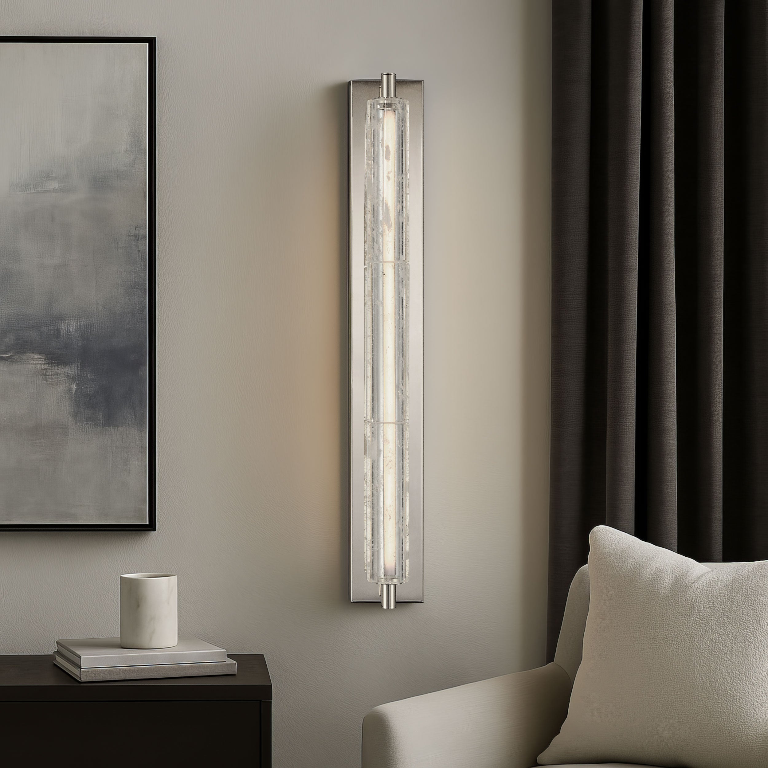 Christoff wall sconce in an antique black iron finish mounted on a wall