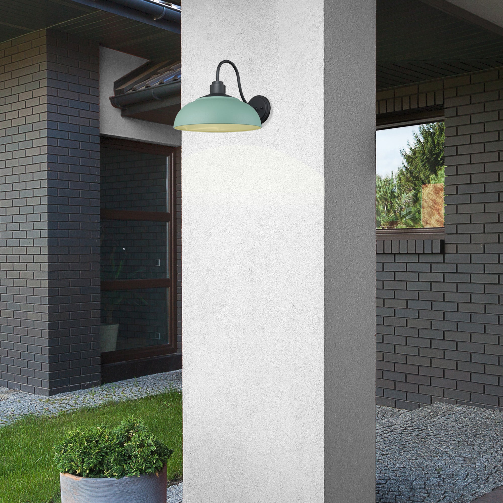 Seaport outdoor wall light in a natural black finish mounted by an entryway