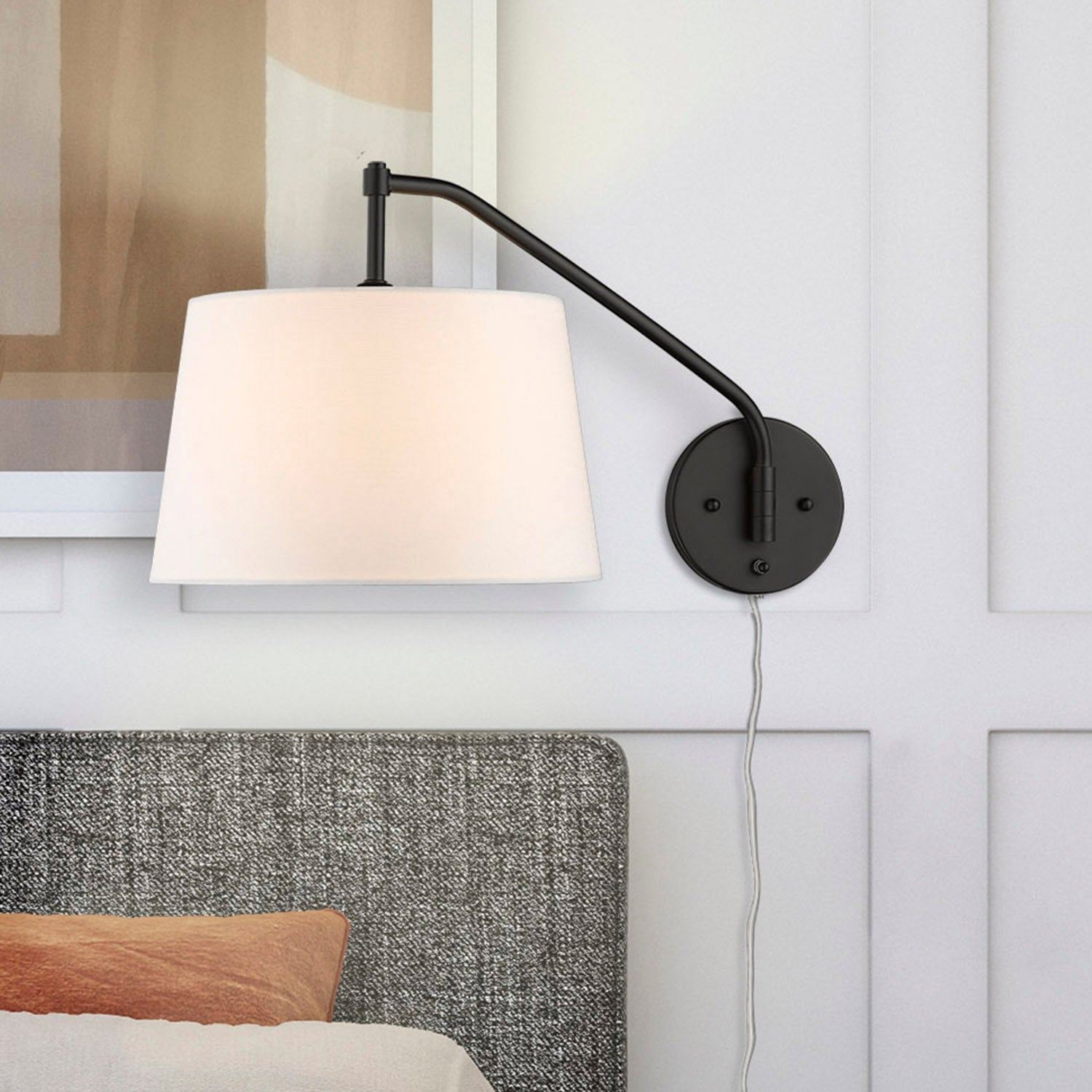 Ryleigh 1-light Swing Arm Wall Lamp in Matte Black and Modern White shade, room scene detail - Golden Lighting