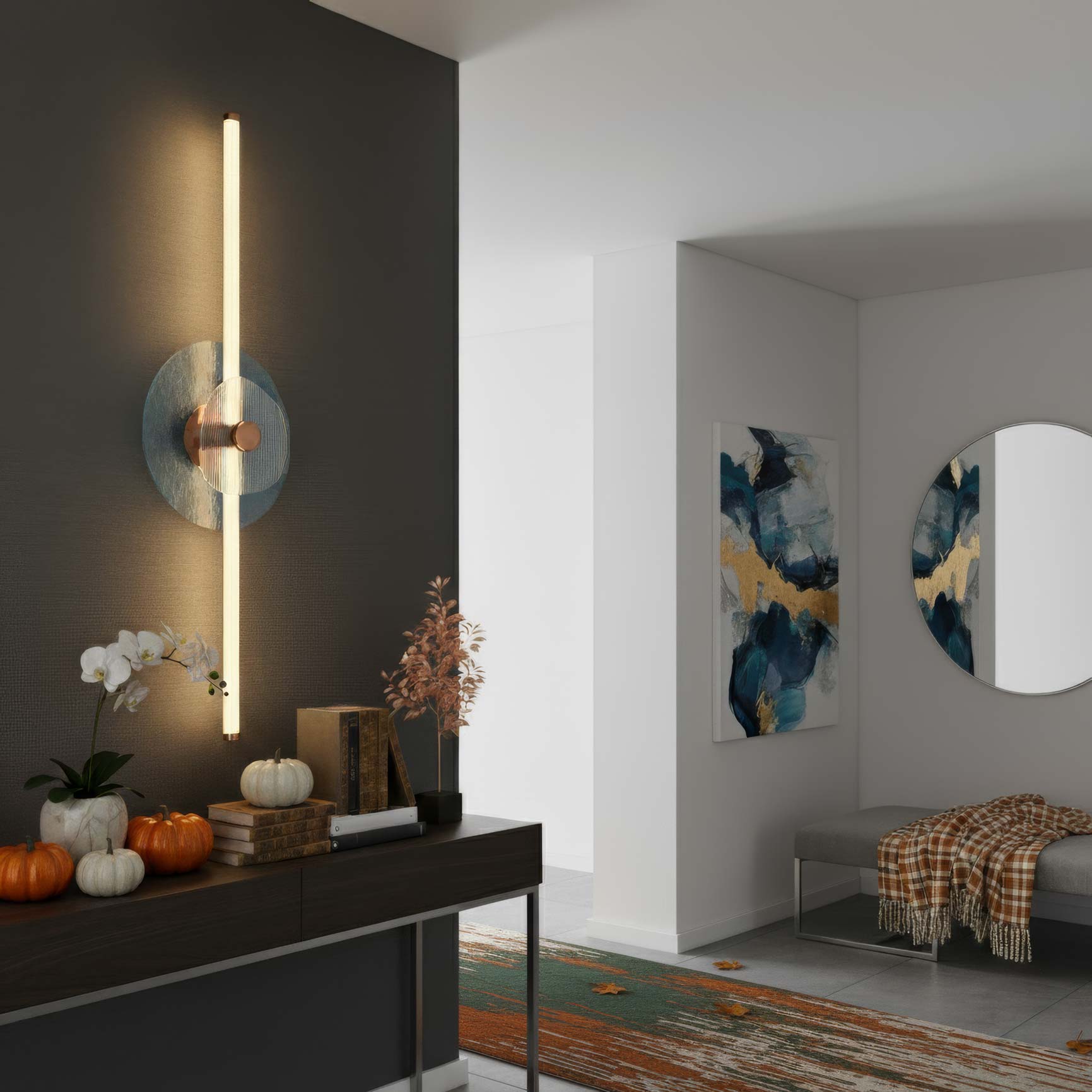 Modern interior design with our Colorella wall sconce in rose gold finish with blue and clear ribbed glass panels, console table, and abstract art.