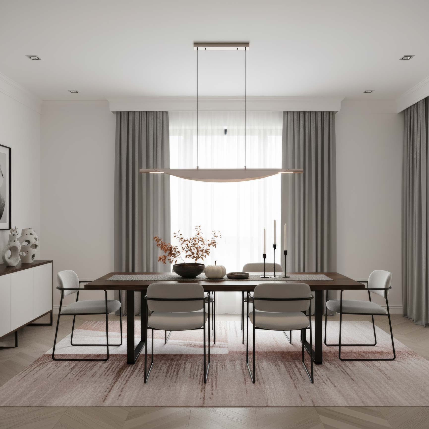 Modern dining room with a wooden table, chairs, and decorative elements. Above is featuring Luma 42" Linear Pendant in Coffee Silver.