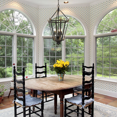 Matilda 3-light Pendant in Antique Black Iron, shown in a room setting - Golden Lighting