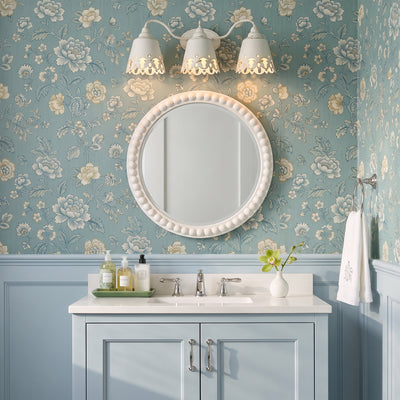 Eloise 3-light Vanity in Antique Ivory, AI-visualized bathroom scene - Golden Lighting