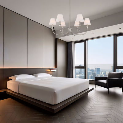 Cambria 6-light Chandelier in Polished Nickel with White Shades, shown in a room setting - Golden Lighting