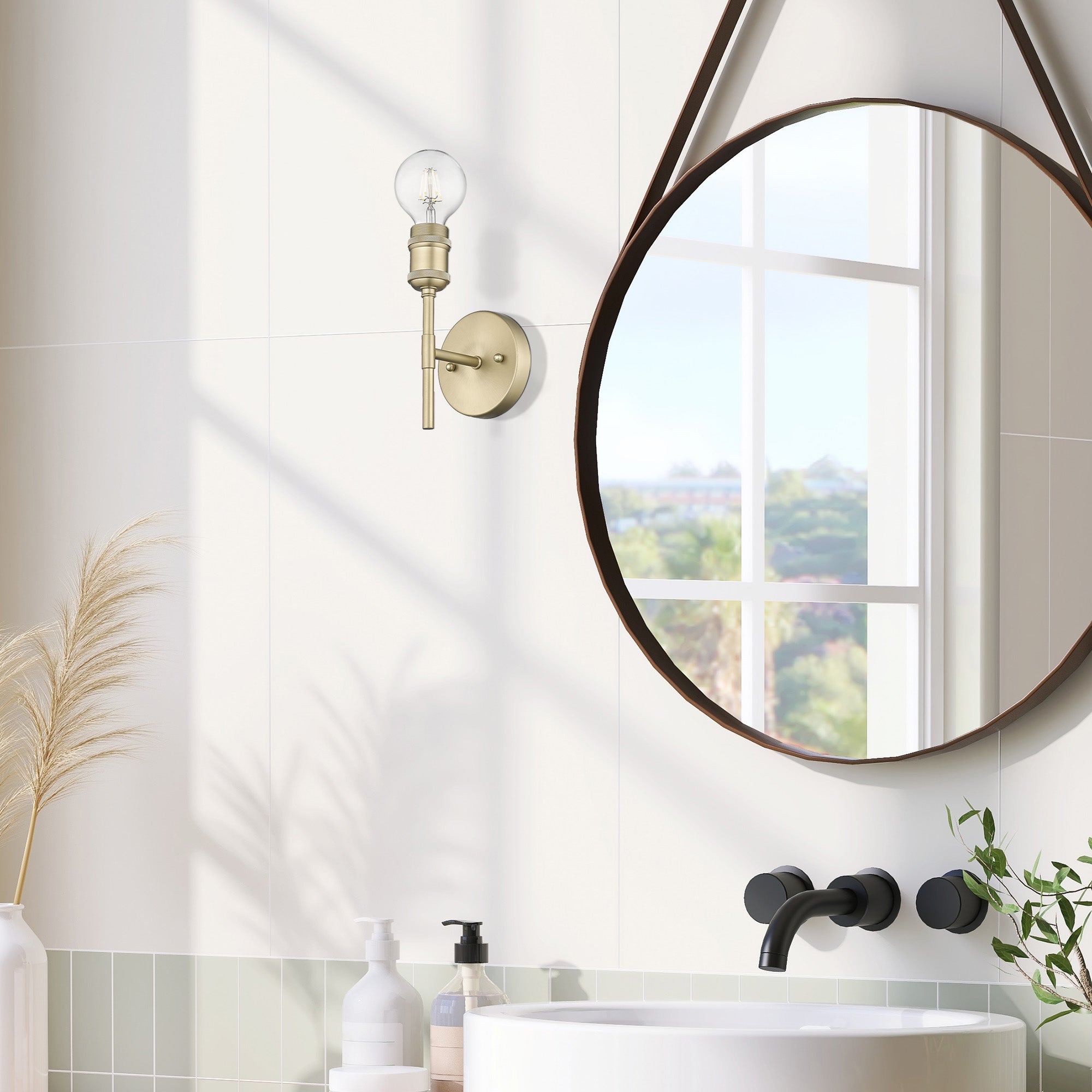 Axel 1-light Wall Sconce in Brushed Champagne Brass, shown in a room setting - Golden Lighting