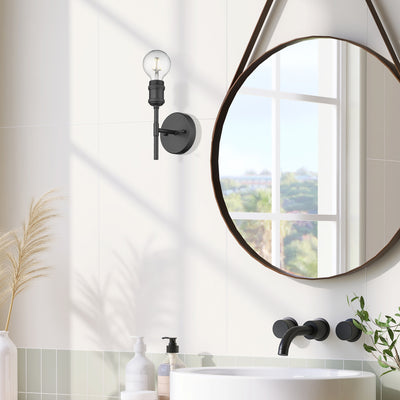 Axel 1-light Wall Sconce in Matte Black, shown in a room setting - Golden Lighting