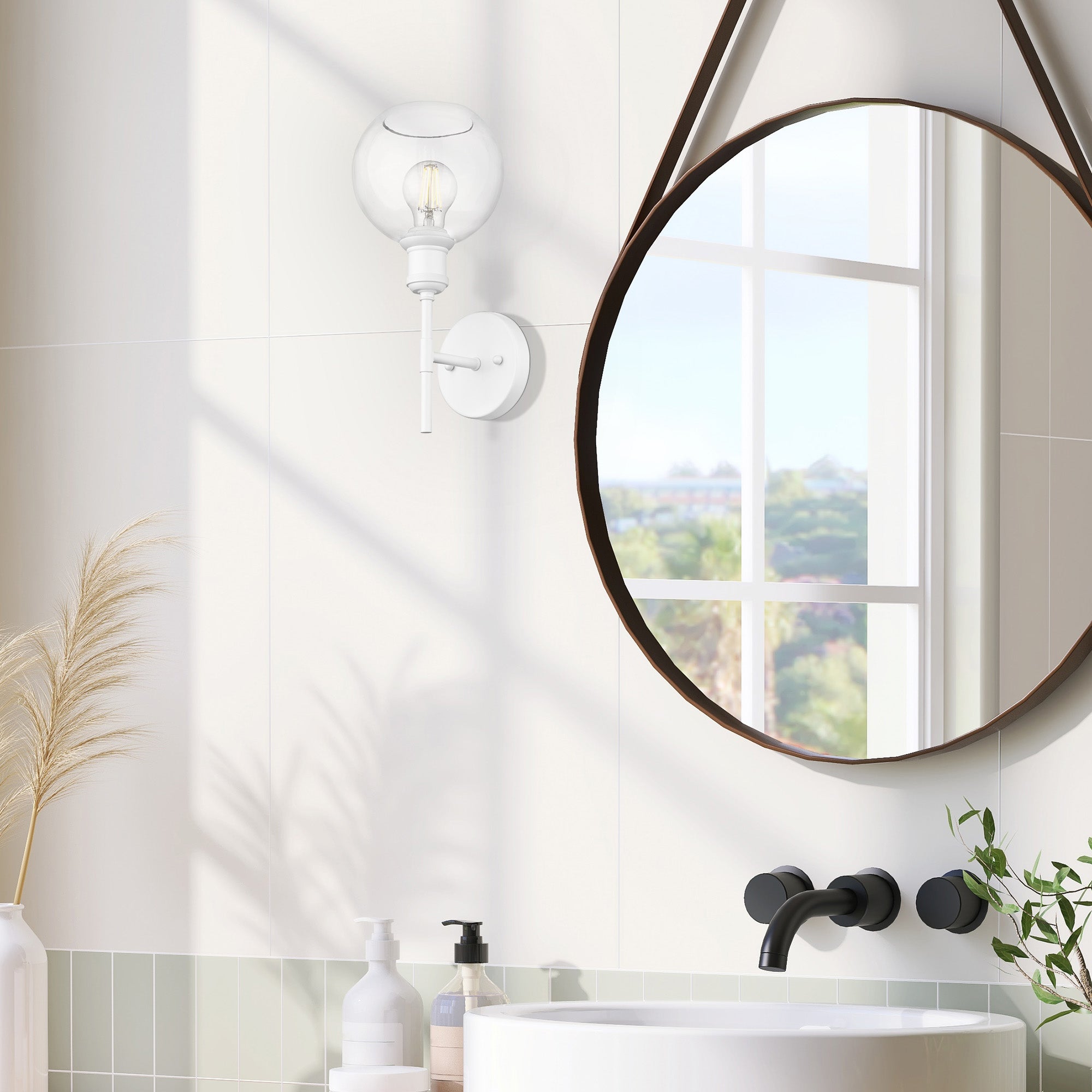 Axel 1-light Wall Sconce in Matte White and Globe Clear Glass, shown in a room setting - Golden Lighting