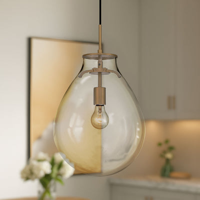 Drop 1-light Pendant in Brushed Champagne Brass and Clear Glass, shown in a room setting - Golden Lighting