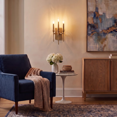Landon 3-light Wall Sconce in Brushed Champagne Brass, AI-visualized living room scene - Golden Lighting