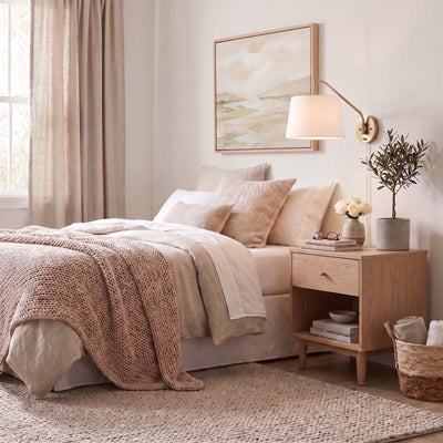 Ryleigh 1-light Swing Arm Wall Lamp in Brushed Champagne Brass, AI-visualized reading nook scene - Golden Lighting