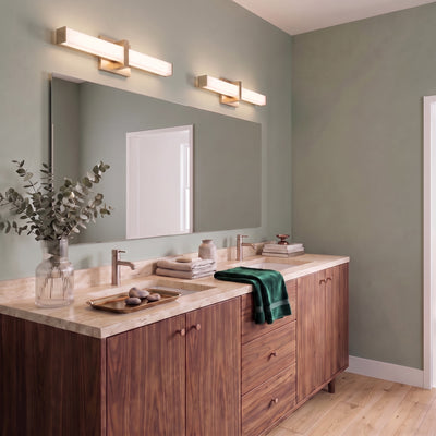 Elon 1-light Vanity in Brushed Champagne Brass, AI-visualized bathroom scene - Golden Lighting