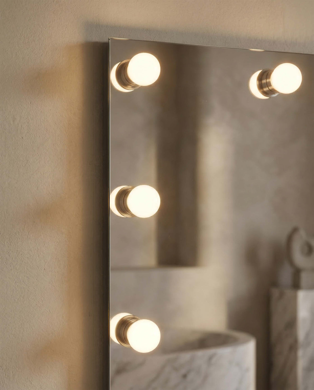 Close-up of the details on the Starlight 30" LED Vanity Mirror with the Clear Glass Globe diffuser option on a neutral background