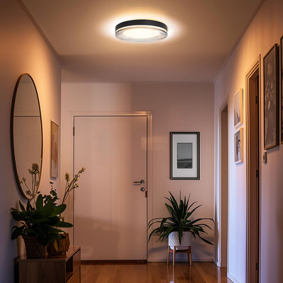 Ondulada Integrated LED 16in Flush Mount in Sand Black and Smoky Acrylic, shown in a room setting - Golden Lighting