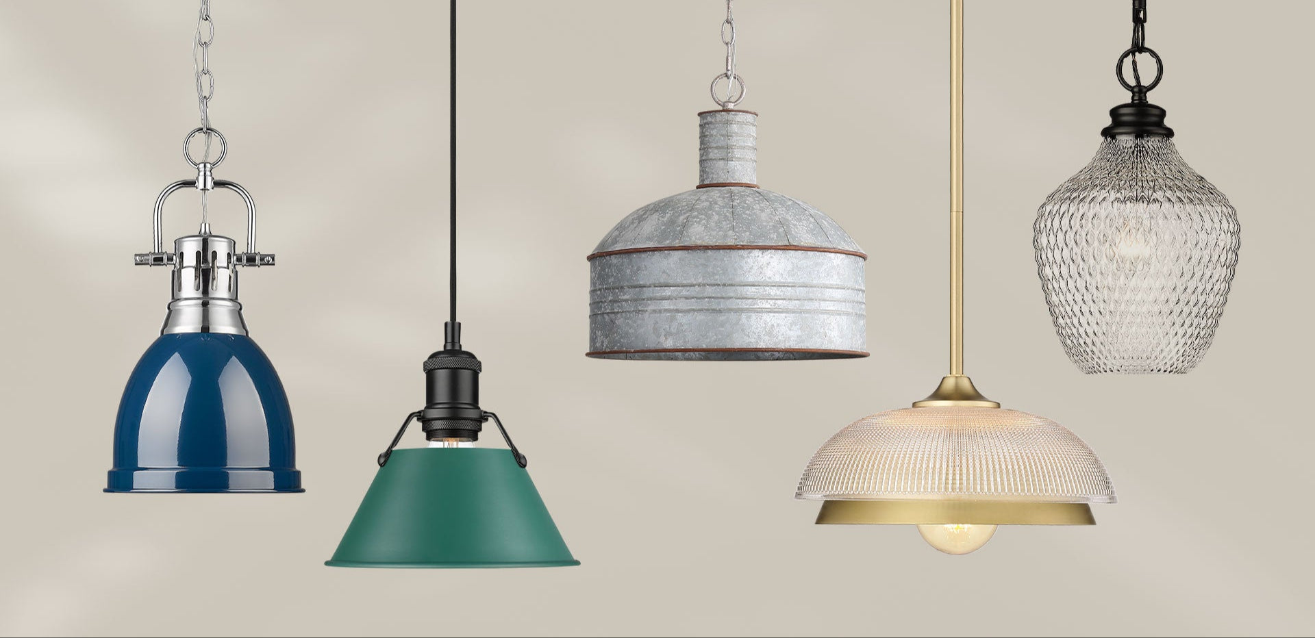 Five pendant lights in various designs and colors hanging against a neutral background